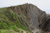 The Stair Hole near Lulworth Cove in Dorset County, England, is a good example of a "crumple" formed when the tectonic plates of Europe and Africa crashed into one another 65 million years ago and helped form the Alps. Photo courtesy of Philip Courter.