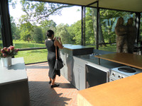 A visitor takes a photo in the kitchen at Philip Johnson's "Glass House" in New Canaan, Connecticut. Photo courtesy of Steve Bergsman. 