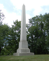 A white obelisk marks the grave of John D. Rockefeller at the Lakeview Cemetery in Cleveland, Ohio. Photo courtesy of Steve Bergsman.