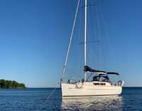  The Breeze lies at anchor in Presque Isle Bay off Stockton Island in the Apostle Islands of Wisconsin. Photo courtesy of Brian Clark. 
