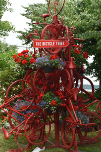 A sculpture titled "The Bicycle Thief" delights cruise ship passengers in Halifax, Nova Scotia. Photo courtesy of Candyce H. Stapen.