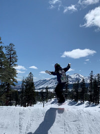 The author's son jumps on a snowboard at Mammoth Mountain, California. Photo courtesy of Margot Black.