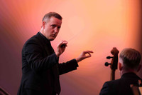  Michael Francis conducts the Mainly Mozart orchestra for locals and visitors in San Diego. Photo courtesy of Ken Jacques. 