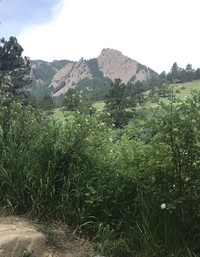 The famous red sandstone Flatirons rise dramatically in the foothills above Boulder, Colorado. Photo courtesy of Lesley Sauls Frederikson.
