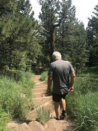 A hiker descends the McClintock Nature Trail above Colorado Chautauqua in Boulder, Colorado. Photo courtesy of Lesley Sauls Frederikson.