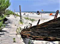  The remains of a shipwreck in the Outer Banks of North Carolina serve to show the wide expanse of white-sand beaches available to visitors. Photo courtesy of Outer Banks Visitors Bureau. 