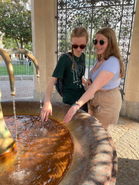  Two young travelers try the famous waters from the hot springs in Wiesbaden, Germany. Photo courtesy of Lesley Sauls Frederikson. 