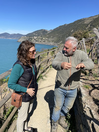  Alessandro Crovara explains the intricacies of caring for grape vines on the steep terraced slopes above Manarola, Italy. Photo courtesy of David Frederikson. 