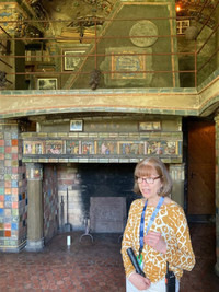 Lisa Crawford points out features of Henry Chapman Mercer's Fonthill Castle in Doylestown, Pennsylvania. Photo courtesy of Bill Neely.