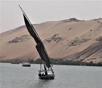 Wooden sailboats called feluccas ply the waters of the Nile River in Egypt. Photo courtesy of Victor Block.