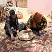  Villagers grind grain into flour along the Nile River in Egypt much as their ancestors did. Photo courtesy of Victor Block. 