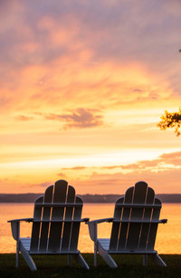 Adirondack chairs overlooking Cayuga Lake in New York's Finger Lakes area provide the perfect end to a day of exploring the area. Photo courtesy of Inns of Aurora.