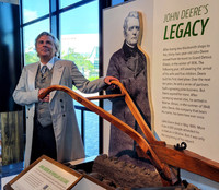 John Deere re-enactor Mischa Hooker demonstrates the plow that broke the plains. Photo courtesy of Jim Farber.