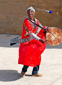  A gnawa musician plays and sings outside the Kasbah des Oudaias in Rabat, Morocco. Photo courtesy of Phil Allen. 