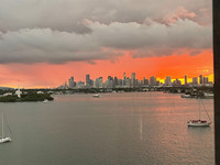  The sun sets behind northern South Beach Miami, Florida, beyond Biscayne Bay. Photo courtesy of Candyce H. Stapen. 