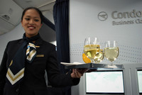 A flight attendant on Condor Airlines offers beverages to passengers en route from Frankfurt, Germany, to Los Angeles. Photo courtesy of Halina Kubalski.