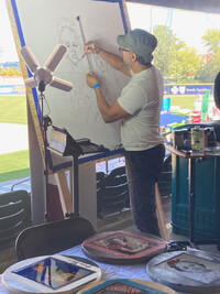 . An artist at the 2022 Hispanic Heritage Festival in Greenville, South Carolina, demonstrates his work. Photo courtesy of Bill Neely. 
