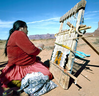  A Navajo woman weaves a traditional rug. Photo courtesy of Robert Paul Van Beets/Dreamstime.com. 