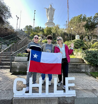 The author and her family pose by the statue of the Virgin Mary on Cerro San Cristobal in Santiago, Chile. Photo courtesy of Margot Black.