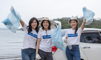 . A group of volunteers incorporate picking up trash into their vacation. Photo courtesy of Eakkachai Halang/Dreamstime.com.
