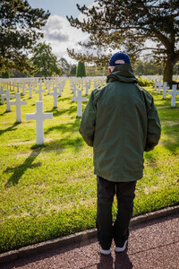 A veteran visits the American Cemetery and Memorial in Normandy, France. Photo courtesy of Road Scholar/Anibas Photography.