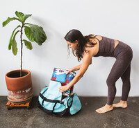  The Yune yoga mat folds into a suitcase for easy packing. Photo courtesy of Yune Yoga. 