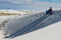     Dune sledding is a popular pastime at New Mexico's White Sands National Monument.  Photo courtesy of Sandra Foyt/Dreamstime.com. 