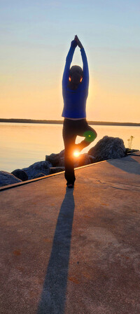  Yoga is a perfect way to greet the sunrise in Door County, Wisconsin. Photo courtesy of Doug Hansen. 