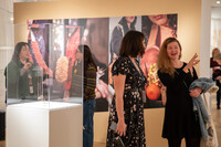  Visitors attend the La Frontera exhibit of jewelry that showcases the juxtapositions surrounding life at the U.S.-Mexico border at the Mingei International Museum in Balboa Park, San Diego, California. Photo courtesy of the Mingei International Museum. 