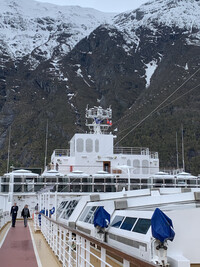  Passengers stroll on the top deck of the Holland America Rotterdam, docked outside charming Eidfjord, Norway, population around 1,000. Photo courtesy of Sharon Whitley Larsen. 
