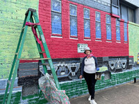  Janette Marvin created the welcoming murals in Clinton, South Carolina. Photo courtesy of Bill Neely. 