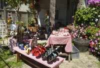  A seller tends his booth at one of the country's many garage sales. Photo courtesy of Gerwin Schadl/Dreamstime.com. 