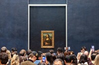  Art lovers visit Leonardo da Vinci's "Mona Lisa" at the Louvre in Paris. Photo courtesy of Bjorn Houdal/Dreamstime.com. 