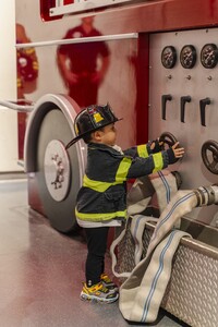A child gets to play at being a firefighter at the Miami Children's Museum in Florida. Photo courtesy of the Miami Children's Museum.