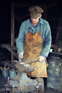  A reenactor at Old World Wisconsin near Eagle demonstrates how blacksmiths once worked. Photo courtesy of Hannah Babiak/Dreamstime.com. 