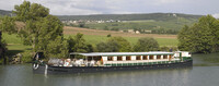 The Nenuphar, one of four barges owned by French Country Waterways, plies the canals of France in luxury. Photo courtesy of French Country Waterways.