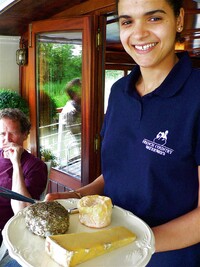 Dinner on the Nenuphar during a voyage through French canals always includes wine and cheese. Photo courtesy of French Country Waterways.