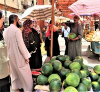  "Slow traveling" provides opportunities to meet local residents, such as these people at a market in Cairo, Egypt. Photo courtesy of Victor Block. 