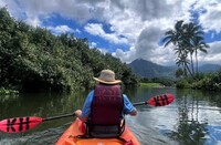  The author kayaks along the Na Pali coast of Kaua'i, Hawaii. Photo courtesy of Jim Farber. 
