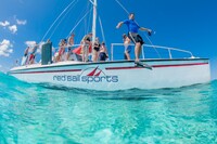  Visitors to the Cayman Islands prepare for some fun in the water. Photo courtesy of Red Sail Sports. 