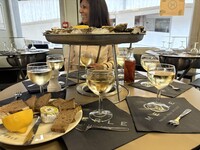  A lunch of oysters and Beaujolais blanc is served at Les Halles de Lyon Paul Bocuse. Photo courtesy of Georgeanne Brennan. 