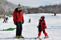An instructor teaches a child to ski at the Massanutten Resort in Virginia. Photo courtesy of Massanutten Resort.