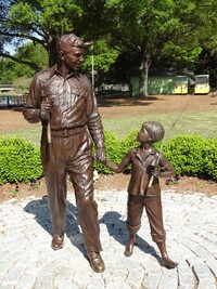 The sculpture of Andy Griffith and a young Ron Howard by Stuart Williamson welcomes visitors to Mount Airy, North Carolina. Photo courtesy of Kelley Albert/Dreamstime.com.