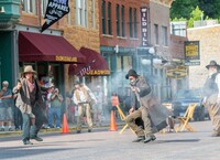 A gunfight reenactment in Deadwood, South Dakota, reminds visitors of that city's storied past. Photo courtesy of Jesse Kraft/Dreamstime.com.