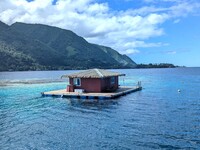 A pearl farm on stilts over pristine lagoon waters is the ideal habitat for cultivating rare Tahitian black pearls. Photo courtesy of Athena Lucero.