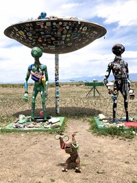  In the UFO Garden north of Hooper, Colorado, offerings left by visitors cover the permanent installations in the shadow of the Sangre de Cristos Mountains. Photo courtesy of Cheryl Thiede. 