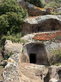  The more than 3,500 ancient cave-like tombs shaped with stone pickaxes at Montessu, Sardinia, are often modeled after the likeness of a house to protect fairies who provided safe havens for the dead before the afterlife journey. Photo courtesy of Alison Ramsey. 