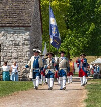  The French Colonial Color Guard at Fort de Chartres, just across the Mississippi River from St. Louis, Missouri, perform for visitors. Photo courtesy of Matthew Mansell/Dreamstime.com. 