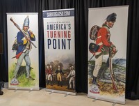 . Posters announce the celebration of the Battles of Saratoga in Saratoga, New York, which changed the course of the Revolutionary War. Photo courtesy of Saratoga250/Daniel Wilson Photography. 