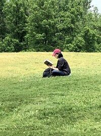 A woman finds a quiet place to read in Montreal's Mount Royal Park. Photo courtesy of Cheryl Thiede.